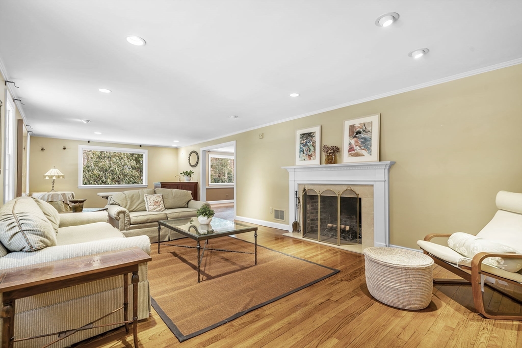 19 Sears Road Wayland, MA 01778 - Photo 4 of 42 a living room with furniture and a fireplace