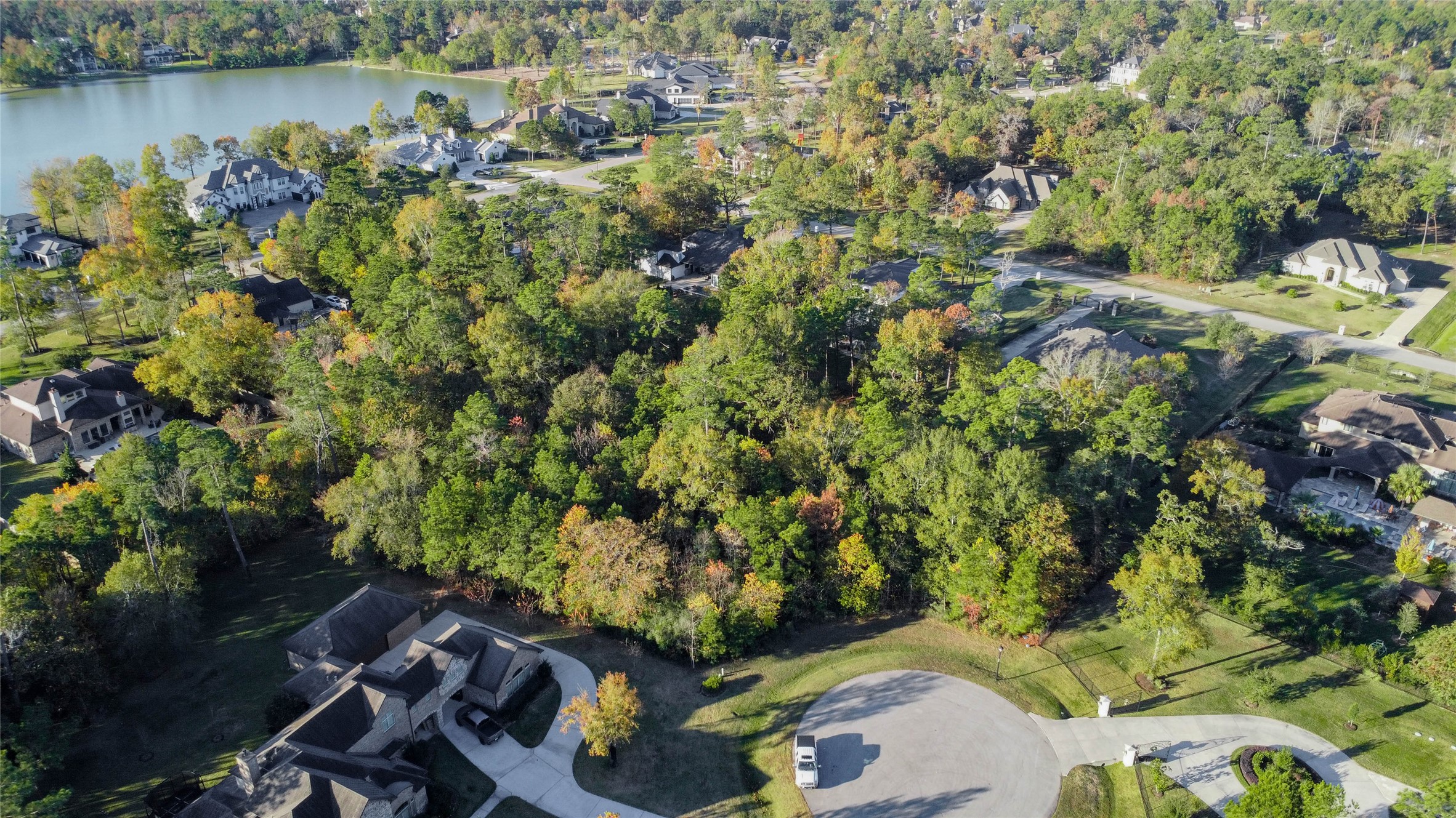 6302 Velvet Sky Court Spring, TX 77386 - Photo 4 of 16 an aerial view of a house with a yard and lake view