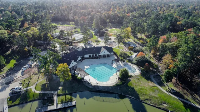 a view of a patio with table and chairs and potted plants