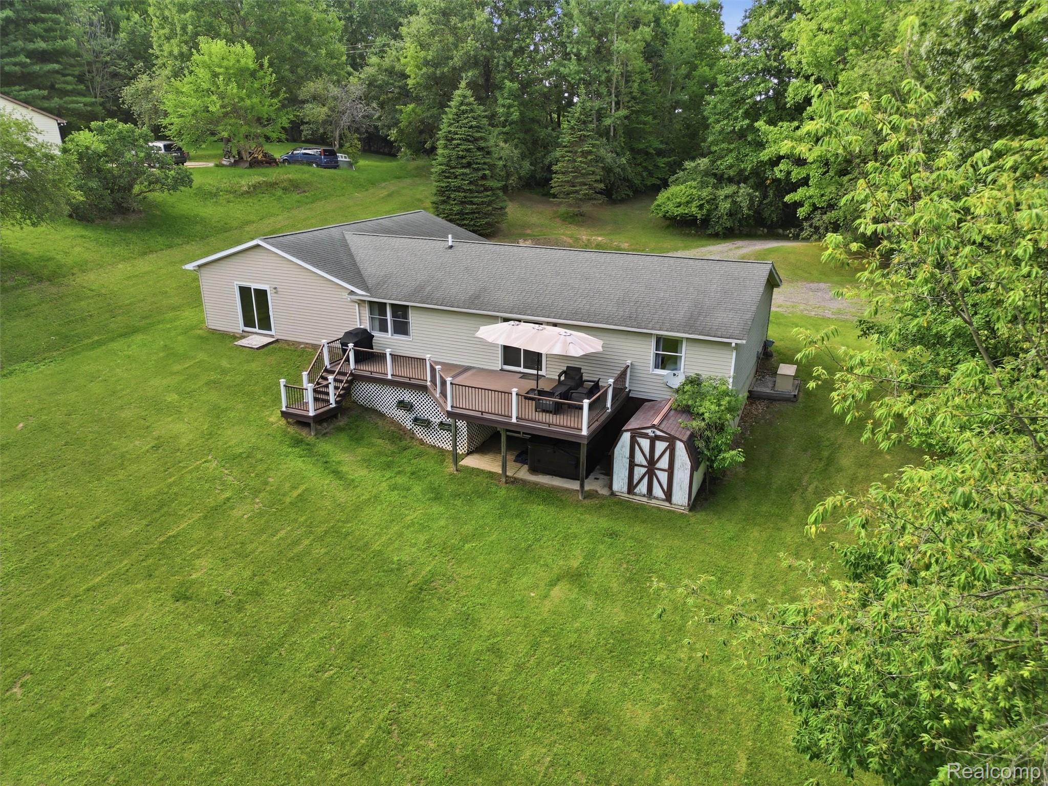 5003 Mason Road Howell, MI 48843 - Photo 53 of 59 Ranch-style residence featuring a gray asphalt shingle roof and light beige siding
