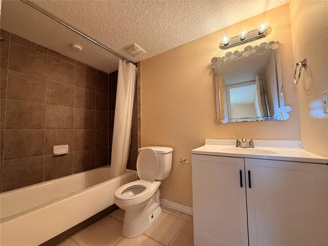 a bathroom with a toilet sink and bathtub