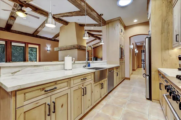 a bathroom with a shower and a sink