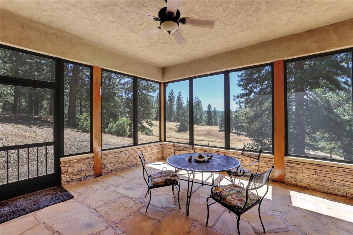 18955 Lake City Road Nevada City, CA 95959 - Photo 22 of 99 a view of a dining room with furniture window and outside view
