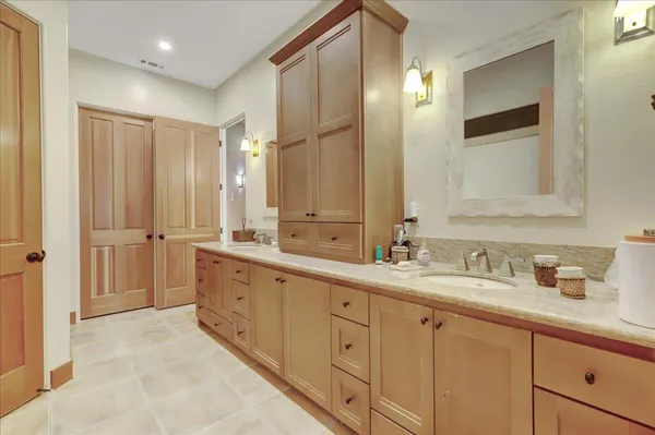 a view of house with yard and trees in the background