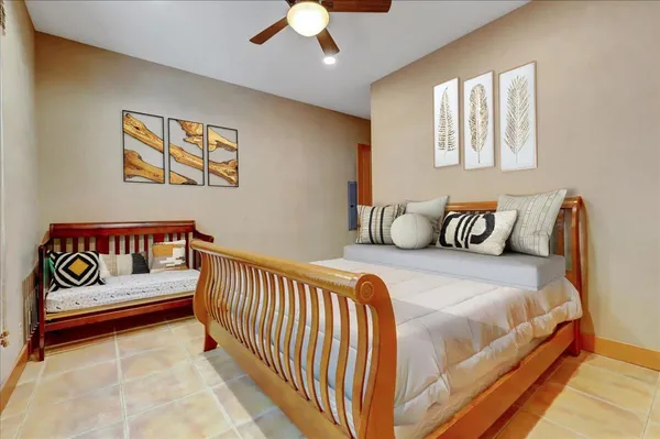 a kitchen with stainless steel appliances kitchen island granite countertop a refrigerator and a wooden floors