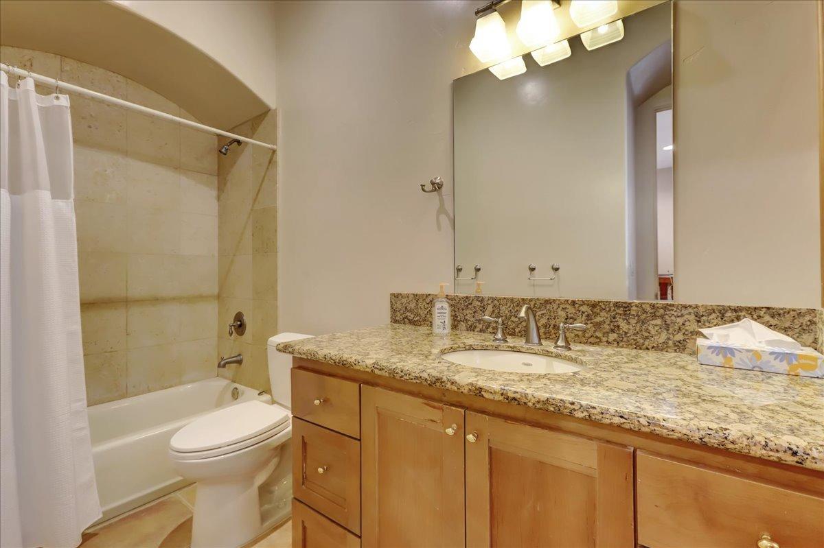 18955 Lake City Road Nevada City, CA 95959 - Photo 36 of 99 a bathroom with a granite countertop sink toilet and shower