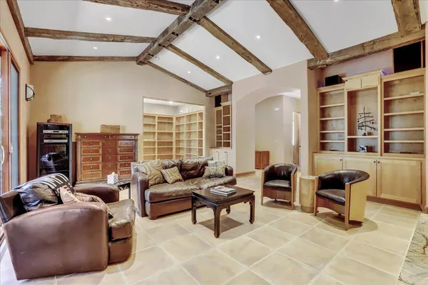 a living room with furniture and a window