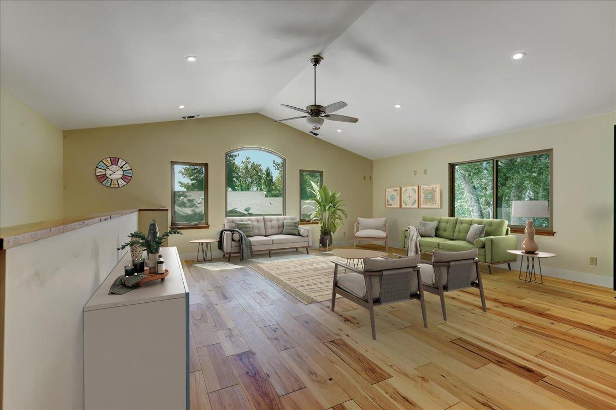 18955 Lake City Road Nevada City, CA 95959 - Photo 42 of 99 a living room with couches and a dining table with wooden floor