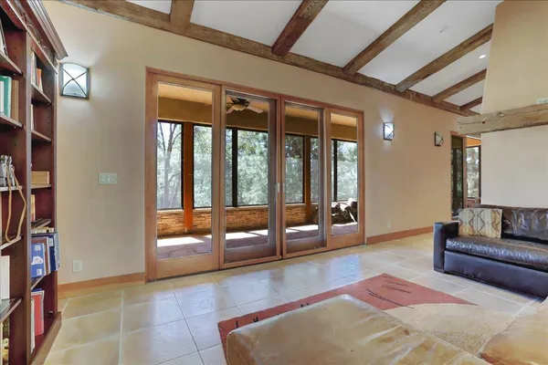 a kitchen with stainless steel appliances granite countertop a table chairs sink and cabinets