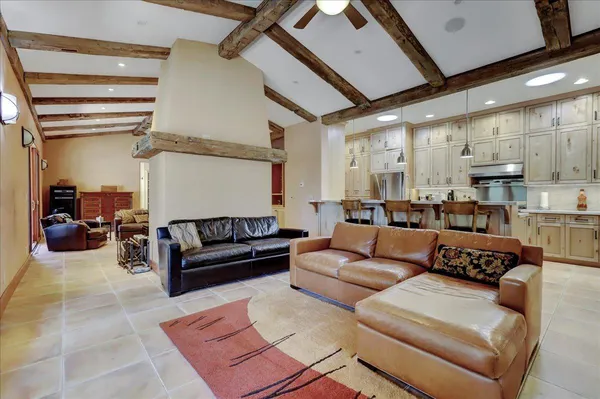 a kitchen with stainless steel appliances granite countertop a sink and a stove