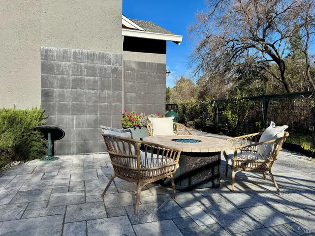 a table and chairs sitting in a backyard