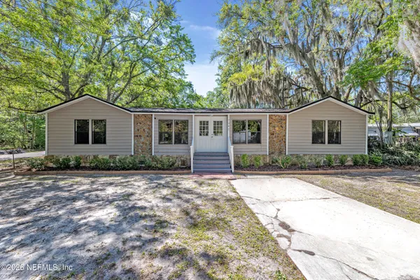 a front view of a house with yard