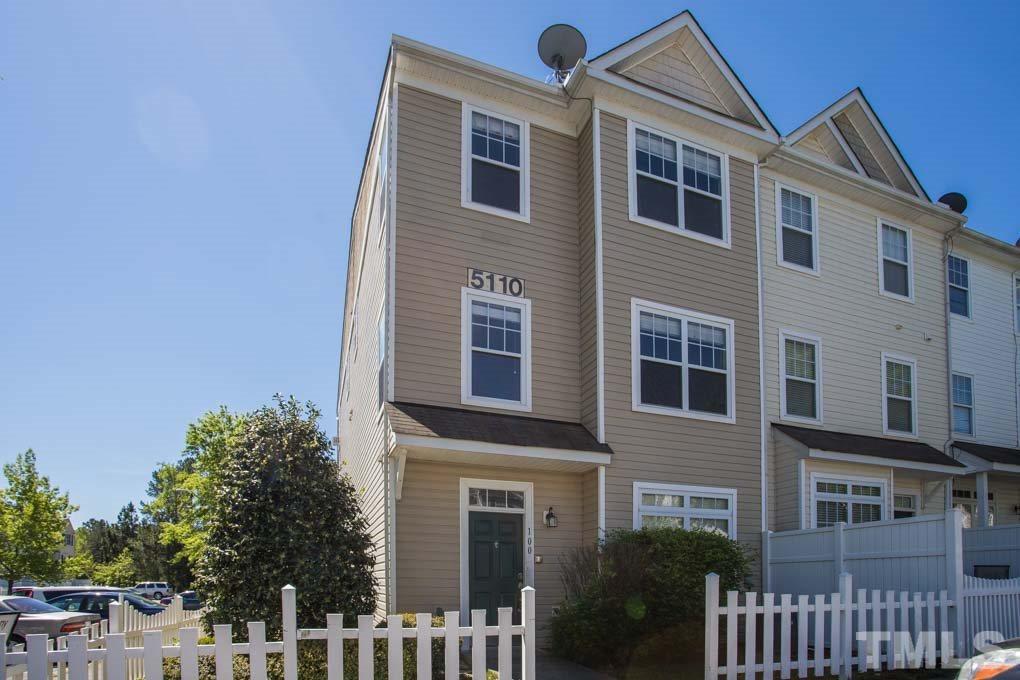 5110 Neuse Commons Lane, Unit 100 Raleigh, NC 27616 - Photo 1 of 27 a front view of a house with a yard