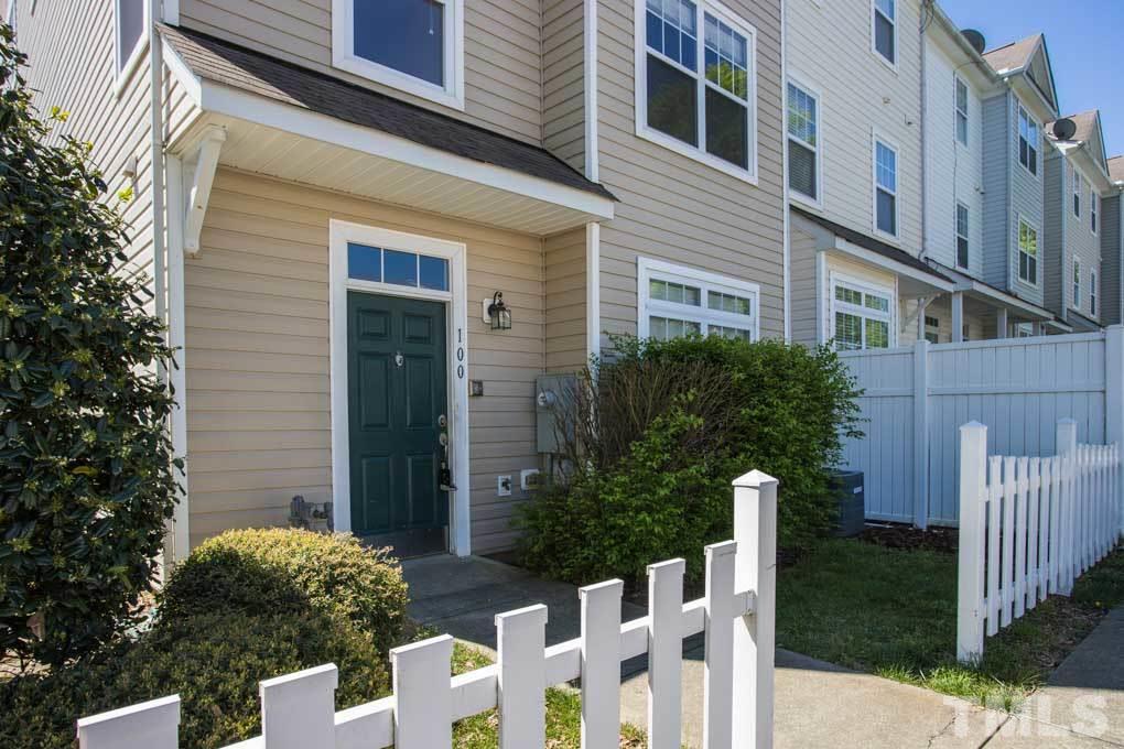 5110 Neuse Commons Lane, Unit 100 Raleigh, NC 27616 - Photo 3 of 27 a view of brick house with a yard