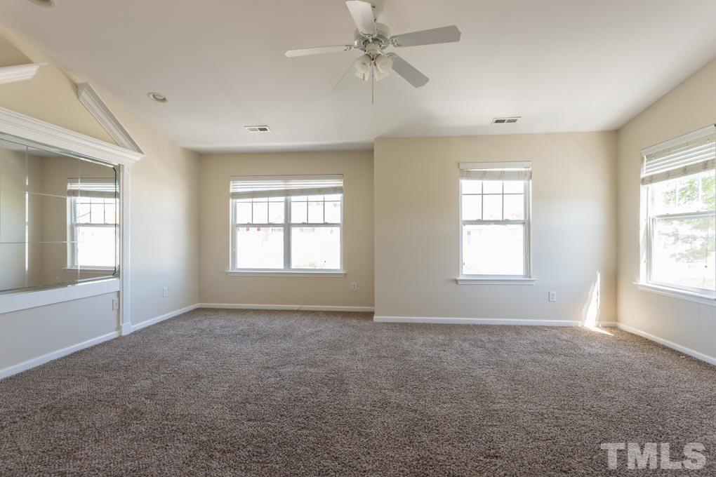 5110 Neuse Commons Lane, Unit 100 Raleigh, NC 27616 - Photo 22 of 27 a view of an empty room with a window