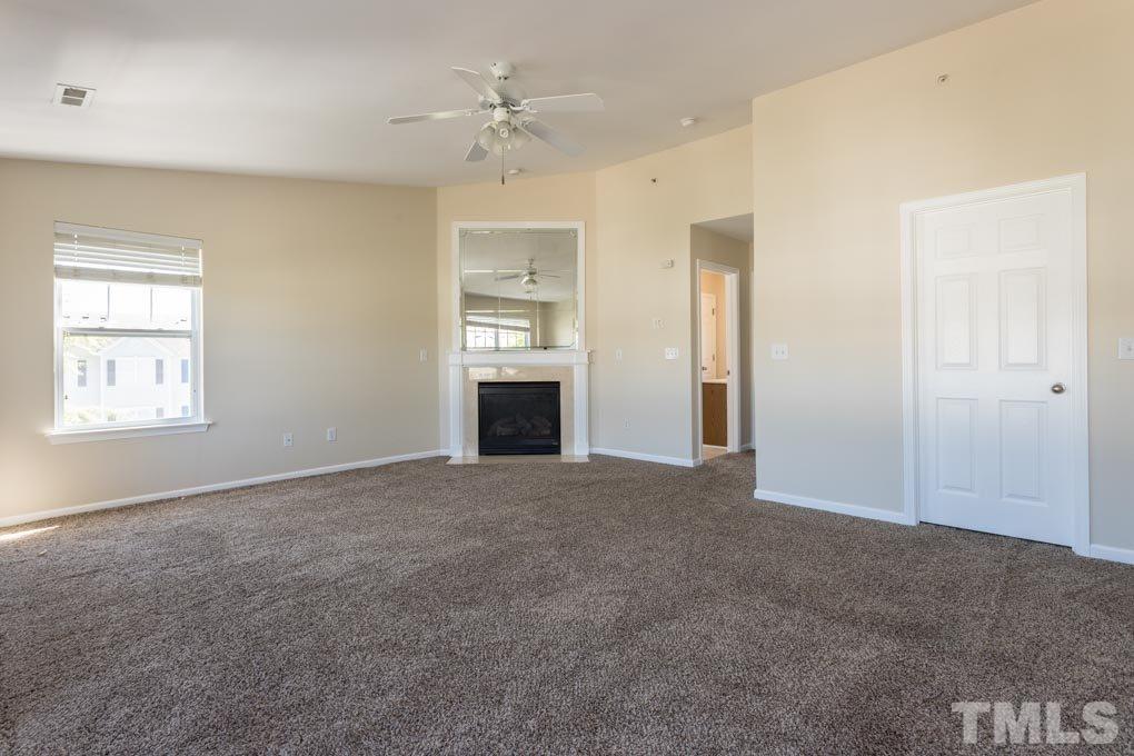 5110 Neuse Commons Lane, Unit 100 Raleigh, NC 27616 - Photo 25 of 27 a view of an empty room with a window