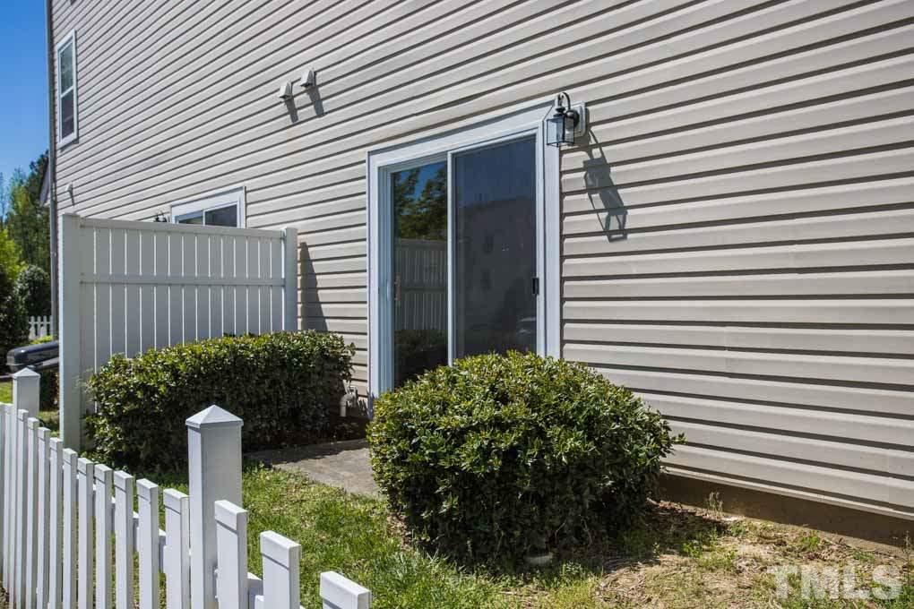5110 Neuse Commons Lane, Unit 100 Raleigh, NC 27616 - Photo 5 of 27 a house with a flower garden