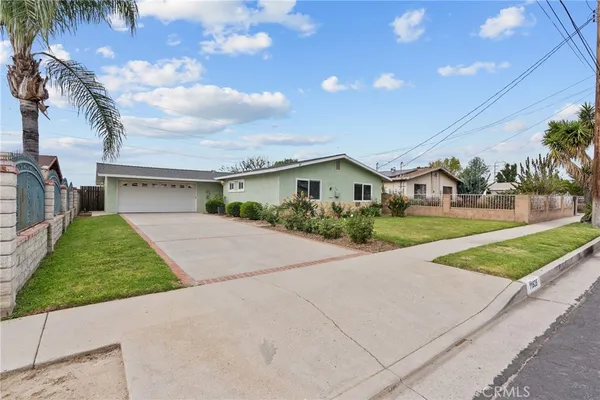 a view of house and outdoor space with yard