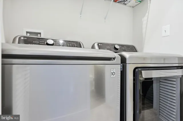 a utility room with washer and dryer