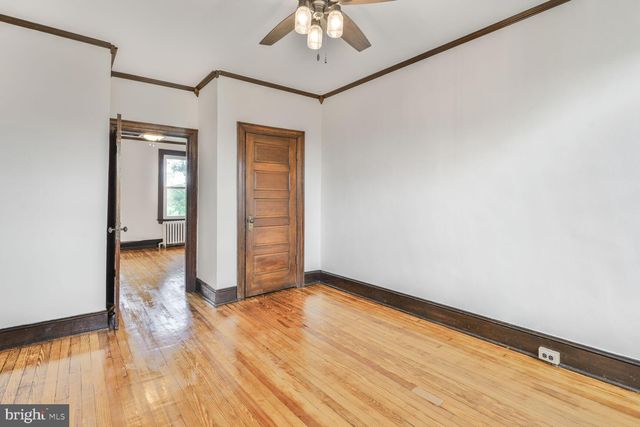 a view of livingroom with hardwood floor and hallway