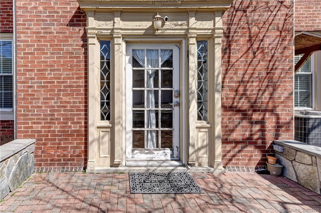 295 Ridge Road, Unit 3 Wethersfield, CT 06109 - Photo 1 of 1 a view of a brick building with many windows