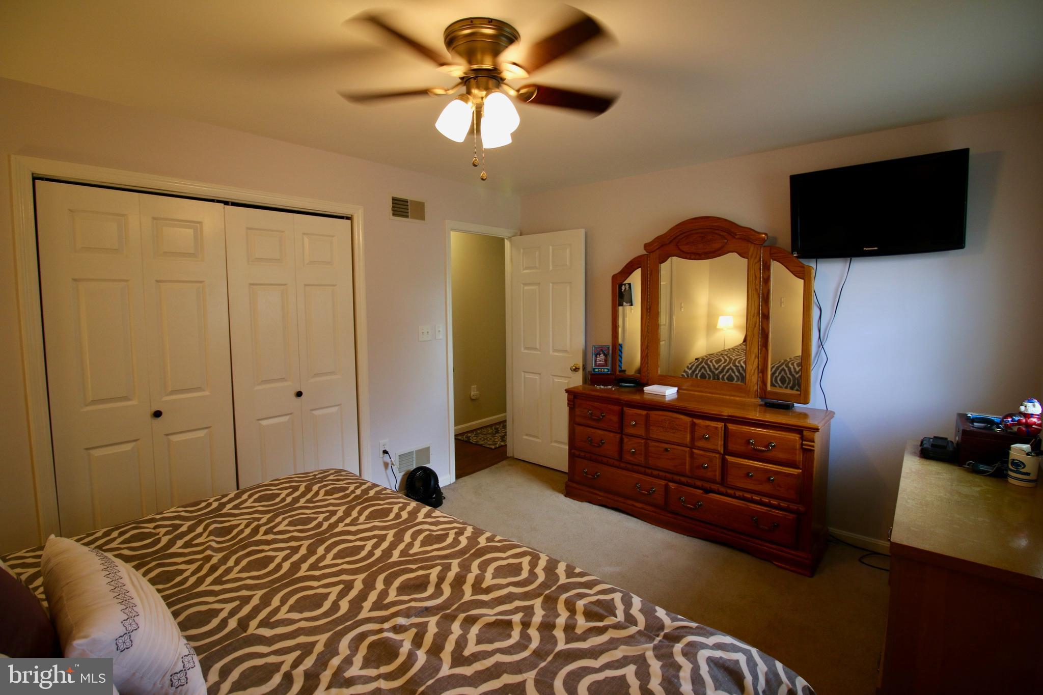 1314 Rawlinsville Road New Providence, PA 17560 - Photo 13 of 22 a bedroom with a bed and a flat tv screen on dresser