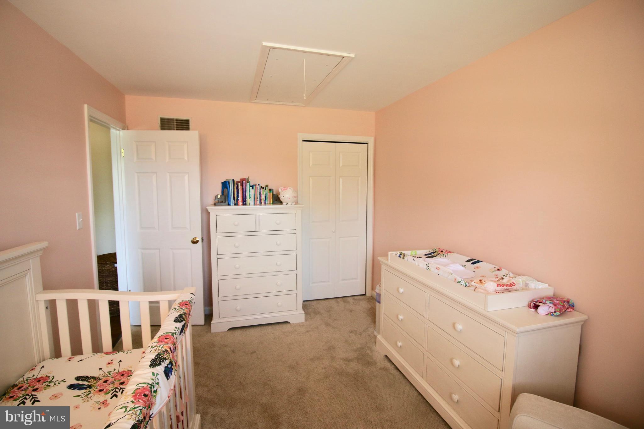 1314 Rawlinsville Road New Providence, PA 17560 - Photo 15 of 22 a bedroom with a baby bed and dresser