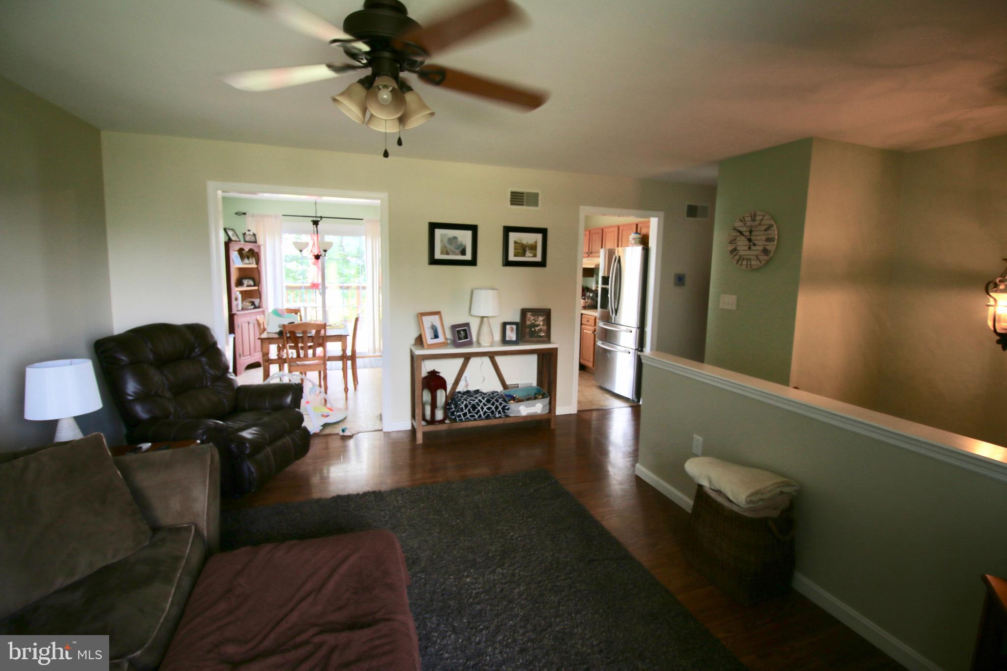 1314 Rawlinsville Road New Providence, PA 17560 - Photo 4 of 22 a living room with furniture and a chandelier