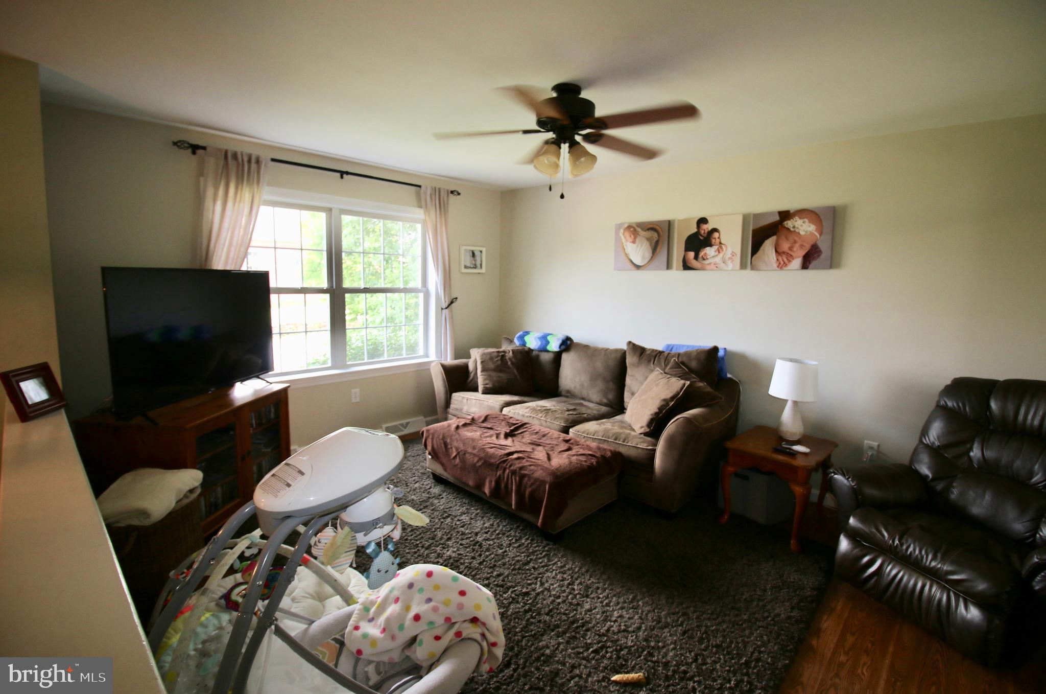 1314 Rawlinsville Road New Providence, PA 17560 - Photo 5 of 22 a living room with furniture and a flat screen tv
