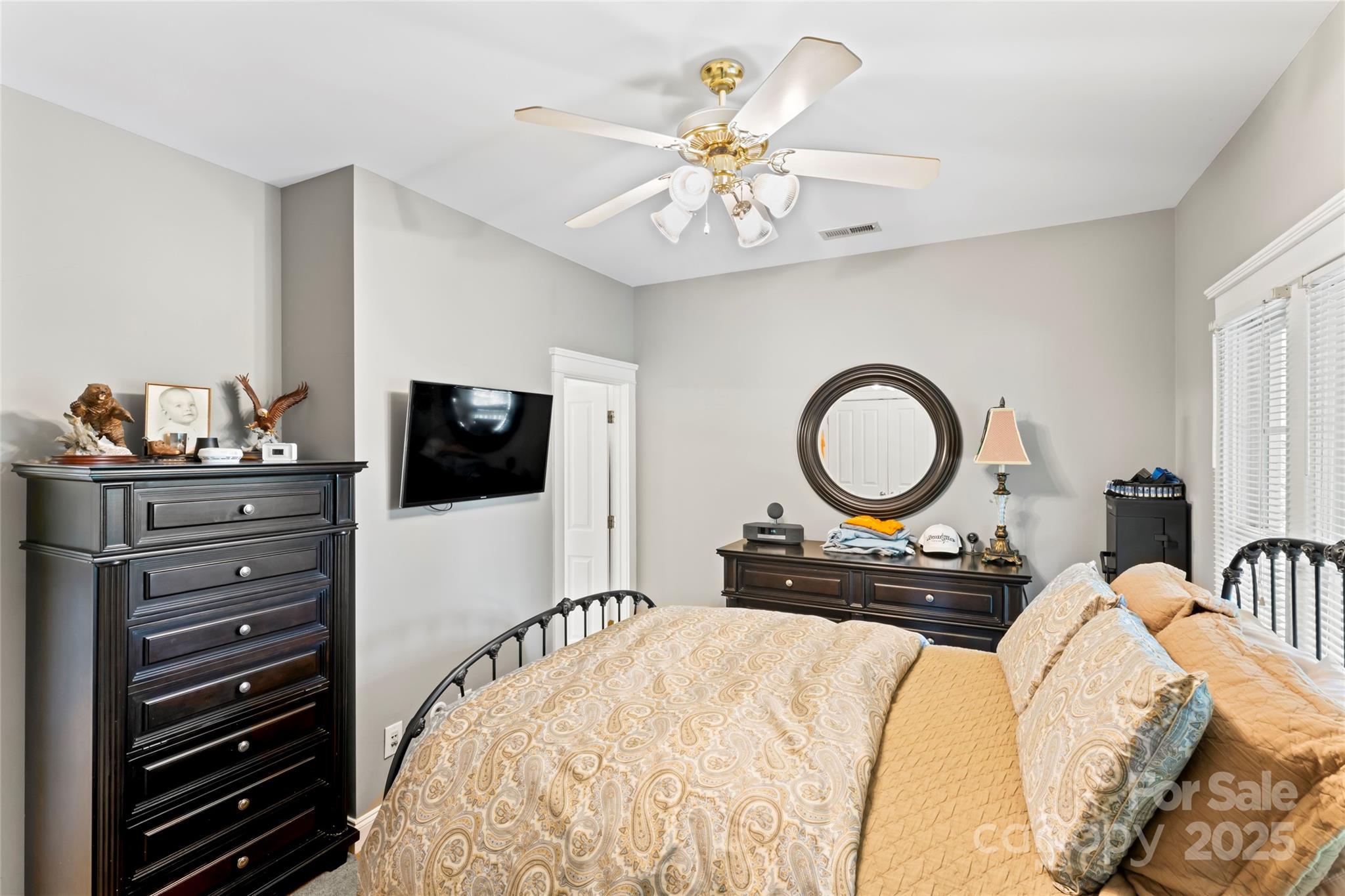 3007 Colonel Springs Way Fort Mill, SC 29708 - Photo 11 of 40 a bedroom with a bed and a flat screen tv