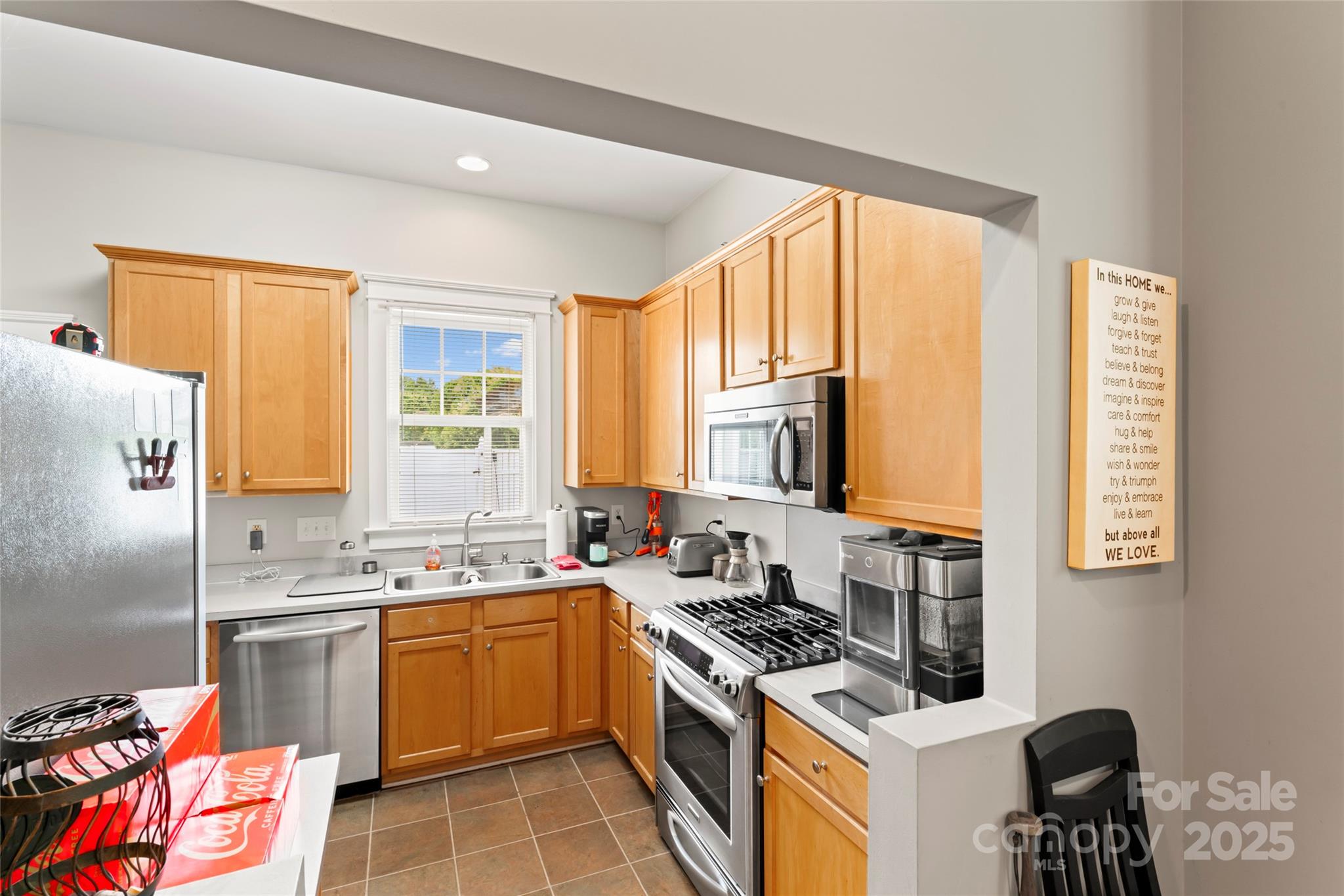 3007 Colonel Springs Way Fort Mill, SC 29708 - Photo 3 of 40 a kitchen that has a sink a stove and a refrigerator