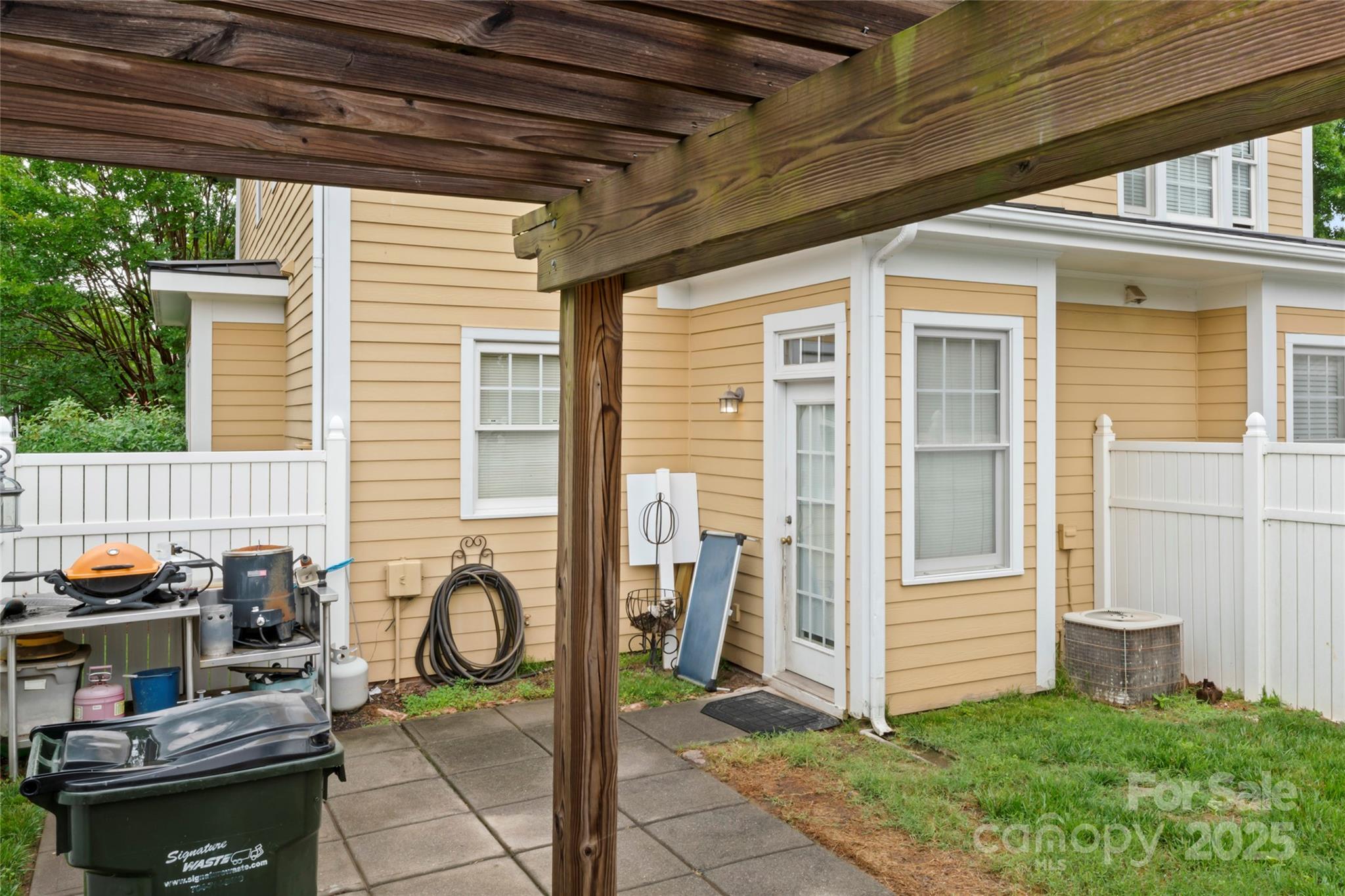3007 Colonel Springs Way Fort Mill, SC 29708 - Photo 33 of 40 a backyard of a house with barbeque oven table and chairs