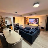 a living room with furniture and a flat screen tv