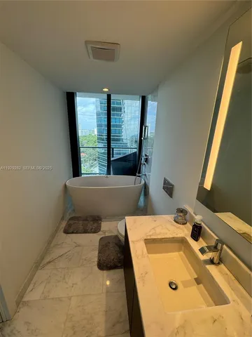 a stove top oven sitting inside of a kitchen