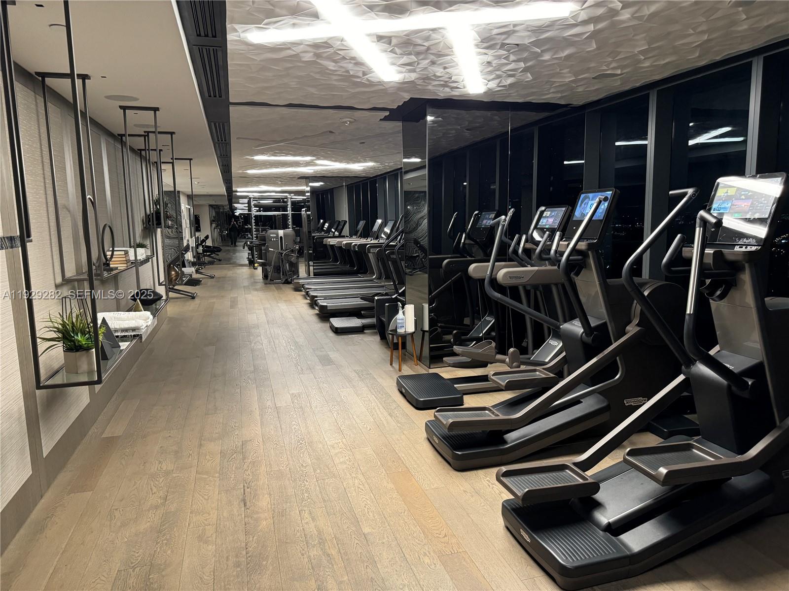 1451 Brickell Avenue, Unit 1105 Miami, FL 33131 - Photo 30 of 47 a view of a room with gym equipment