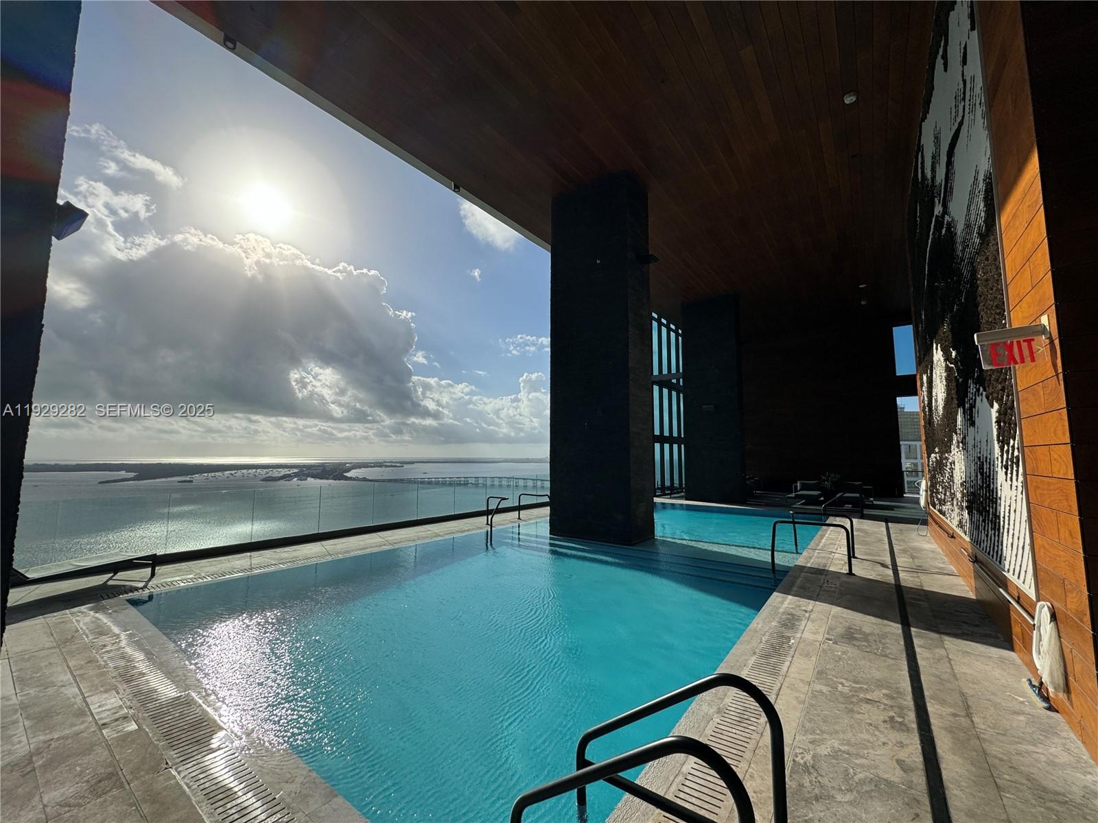 1451 Brickell Avenue, Unit 1105 Miami, FL 33131 - Photo 32 of 43 a view of swimming pool with a yard