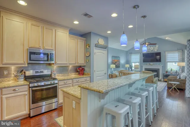 a view of an entryway with paintings on the wall