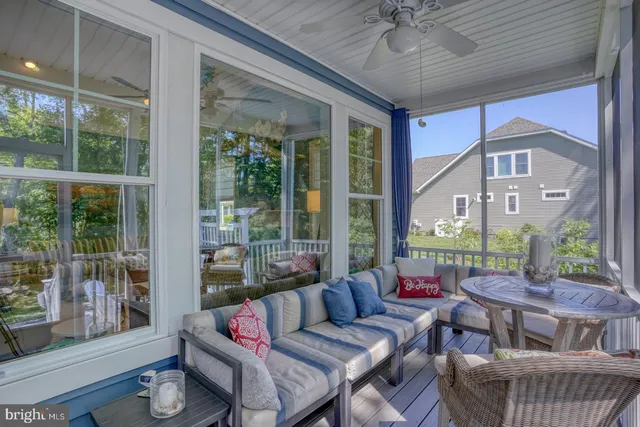 a view of a livingroom with furniture window and wooden floor
