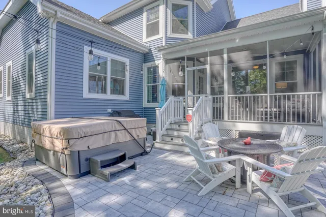 a view of a dining room with furniture and a window