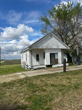 a big house with a big yard and large trees