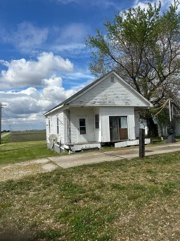 a big house with a big yard and large trees