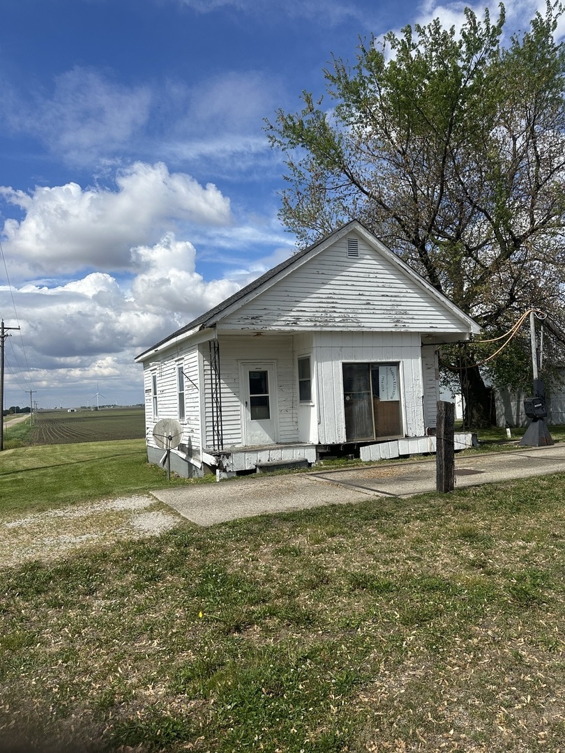 a big house with a big yard and large trees