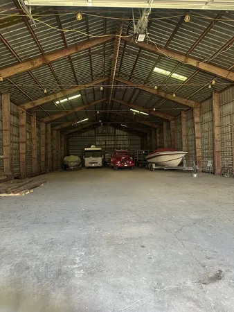 a view of parking garage with cars