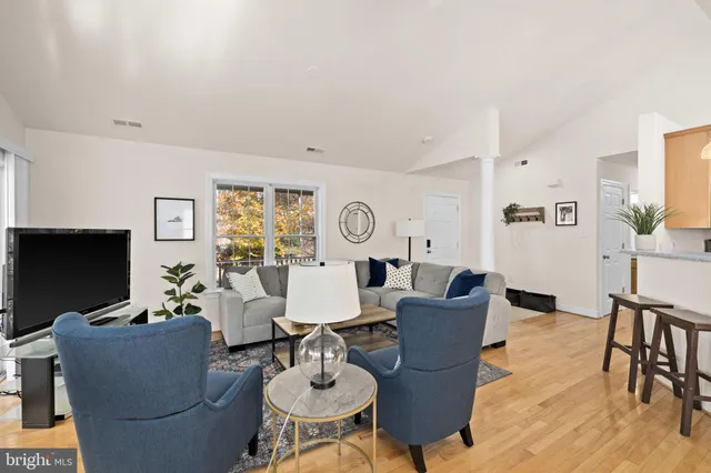 a bedroom with a large bed and a large window