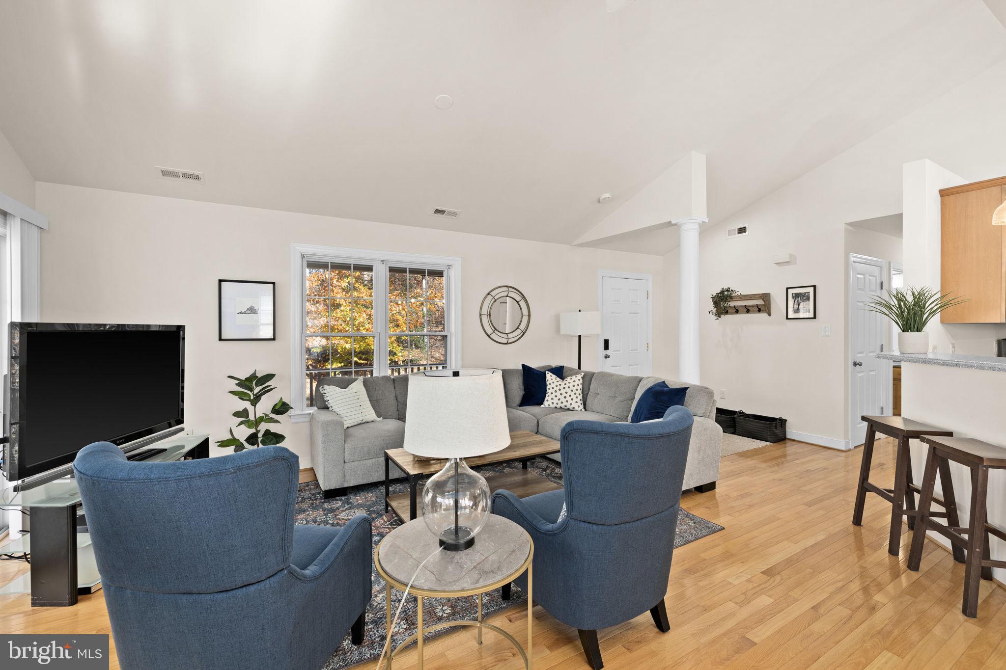 14 Oak Road Bumpass, VA 23024 - Photo 24 of 75 a living room with furniture a large window and a flat screen tv