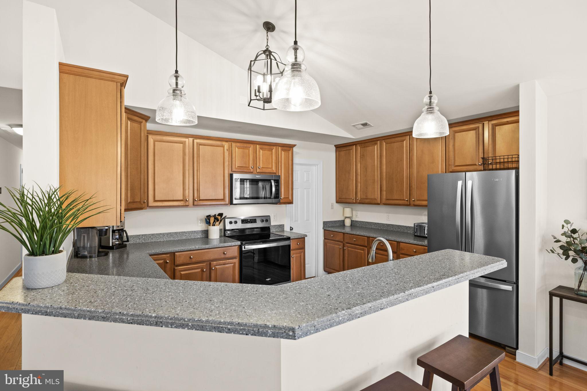 14 Oak Road Bumpass, VA 23024 - Photo 28 of 75 a kitchen with stainless steel appliances granite countertop a sink a counter space and cabinets