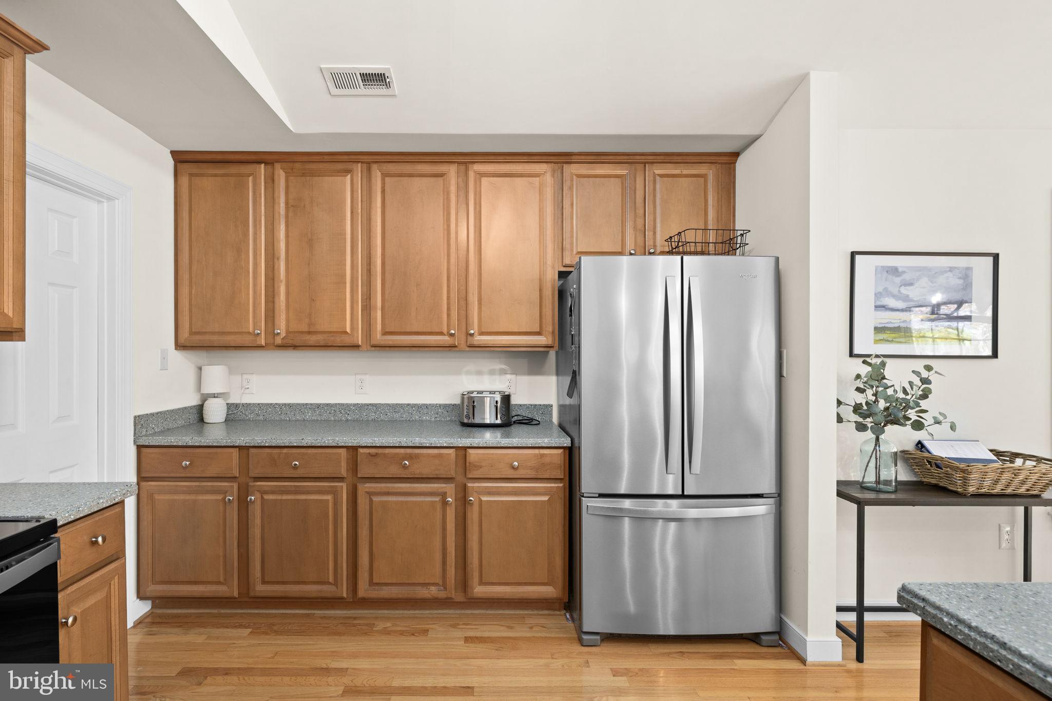 14 Oak Road Bumpass, VA 23024 - Photo 31 of 75 a kitchen with stainless steel appliances granite countertop a refrigerator sink and cabinets