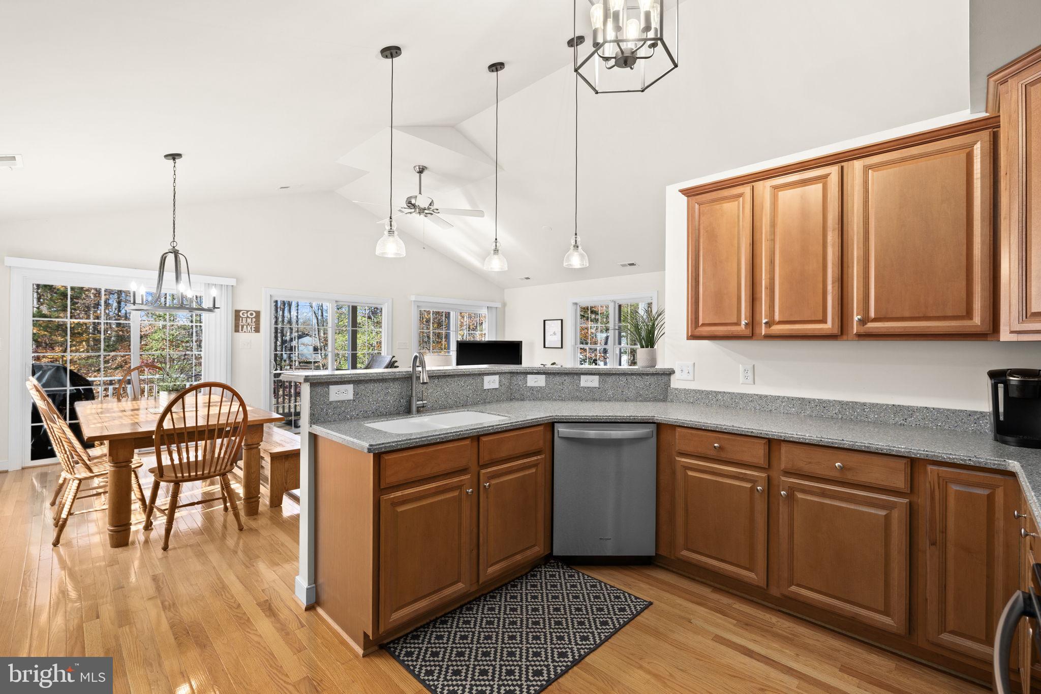 14 Oak Road Bumpass, VA 23024 - Photo 32 of 75 a open kitchen with stainless steel appliances granite countertop a stove and chairs with wooden floors