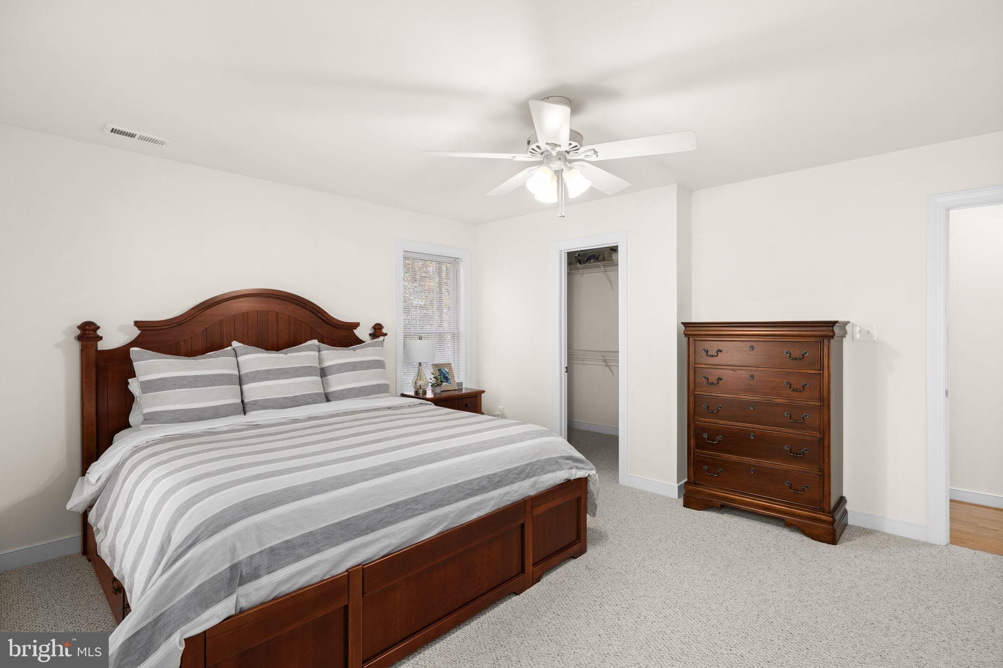 14 Oak Road Bumpass, VA 23024 - Photo 34 of 75 a bedroom with a bed and a chandelier