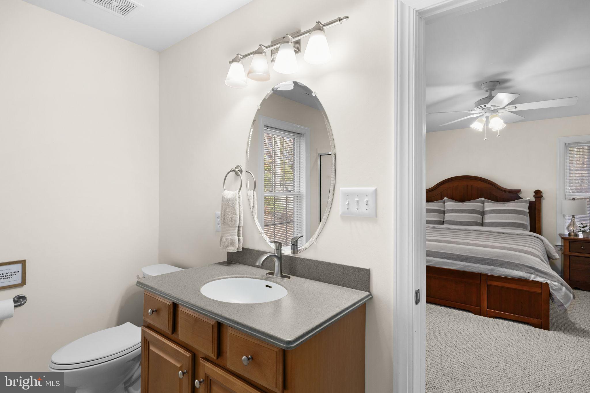 14 Oak Road Bumpass, VA 23024 - Photo 36 of 75 a bathroom with a sink a toilet and a mirror